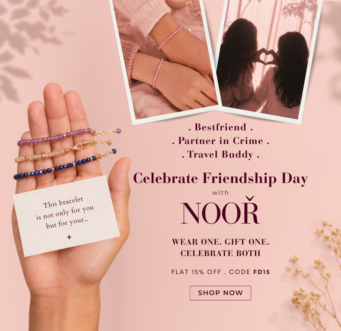 Homepage banner promoting NIVI's NOOR Friendship Day Collection featuring handcrafted natural gemstone bracelets in 925 sterling silver with one-micron gold plating. The banner shows a hand holding four colourful gemstone bracelets with a friendship note, two friends wearing matching pink gemstone bracelets, and a silhouette of friends forming a heart with their hands at sunset. Set against a soft blush pink background, the banner includes the message "Celebrate Friendship Day with NOOR" and the tagline "We