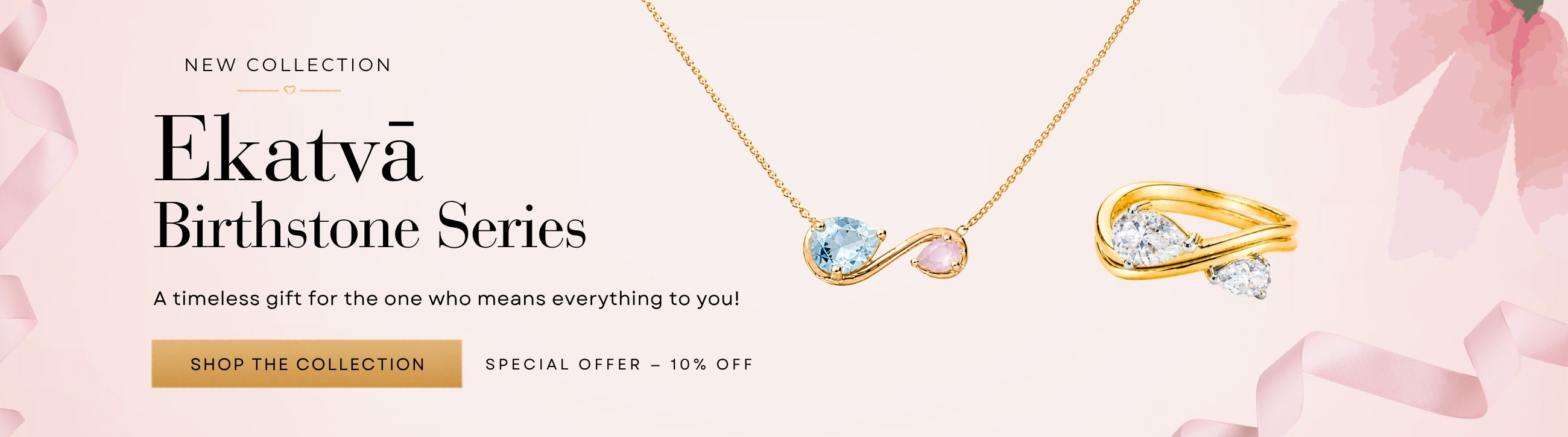 Homepage banner showcasing NIVI's Ekatvā Birthstone Series featuring a handcrafted birthstone necklace and matching ring crafted in 925 sterling silver with one-micron gold plating. The necklace displays two natural birthstones symbolizing the bond between mother and child, while the coordinating ring features sparkling gemstones in an elegant contemporary design. Set against a soft blush pink background with ribbon accents, the banner includes the message "New Collection – Ekatvā Birthstone Series" and the